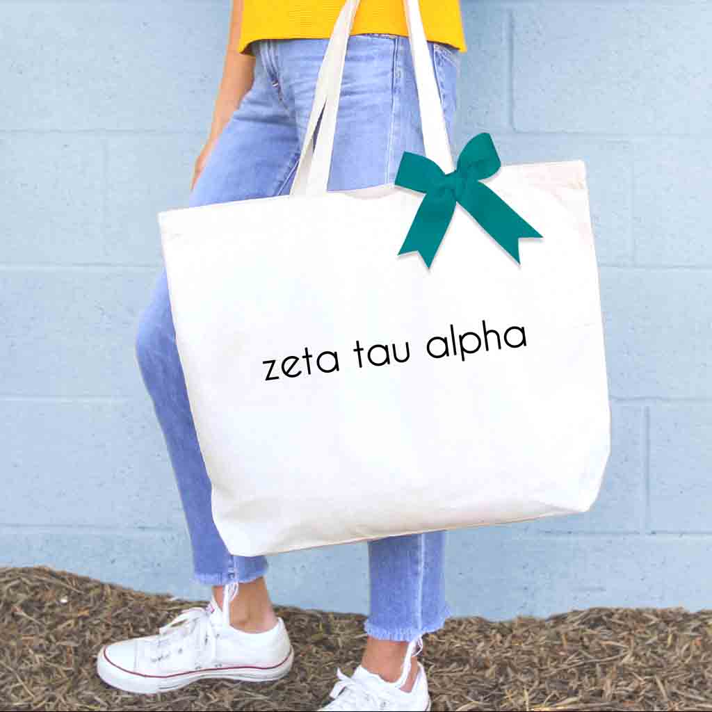 Zeta Tau Alpha sorority name custom printed on canvas tote bag with bow in sorority color