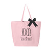 Alpha Chi Omega sorority name and letters digitally printed on pink canvas tote bag.