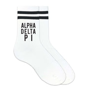 Alpha Delta Pi sorority name in black ink digitally printed on black striped crew socks.