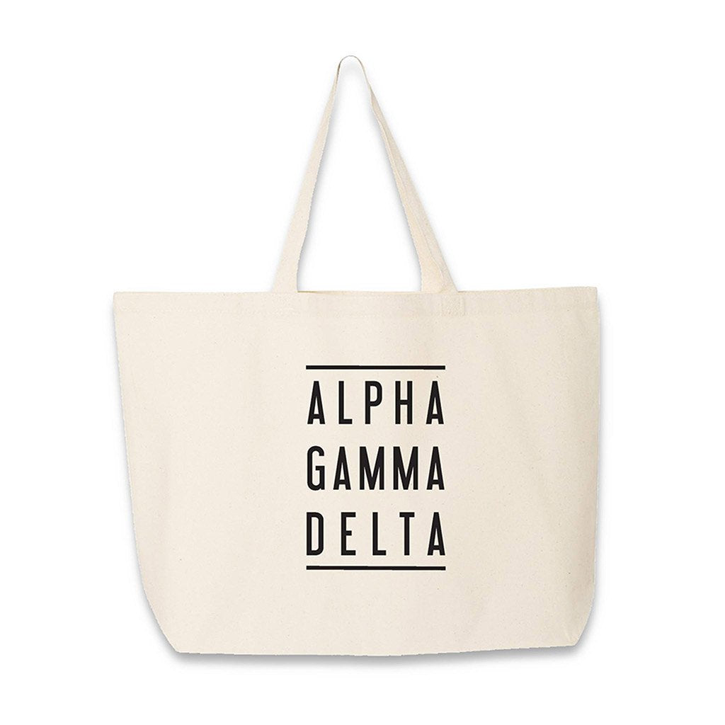 Alpha Gamma Delta sorority name in block letters with lines digitally printed on canvas tote bag.