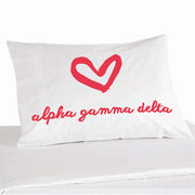 Alpha Gamma Delta sorority name in sorority colors with heart design digitally printed on pillowcase.