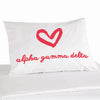 Alpha Gamma Delta sorority name in sorority colors with heart design digitally printed on pillowcase.