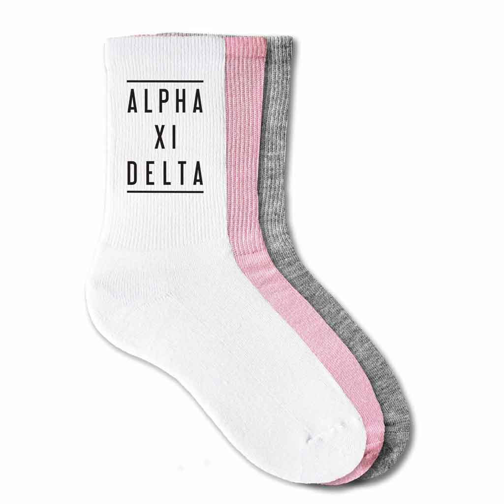 Alpha Xi Delta sorority name custom printed on white, pink, or heather gray cotton crew socks