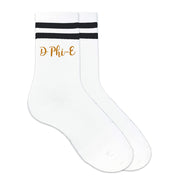 Delta Phi Epsilon nickname D Phi E digitally printed in sorority color ink on the side of black striped crew socks.