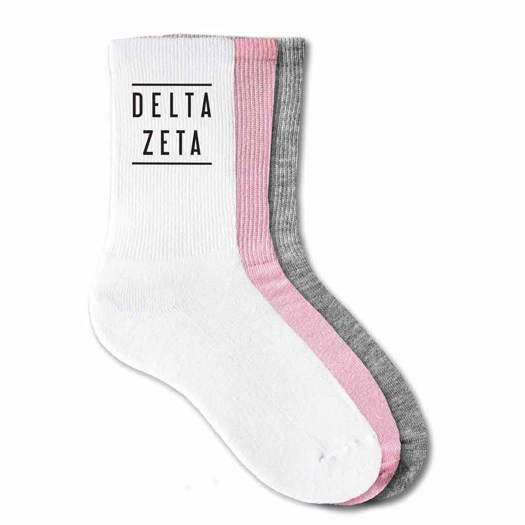 Delta Zeta sorority name custom printed on cotton crew socks available in white, pink, or heather gray