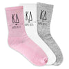 Kappa Delta sorority digitally printed on the side of crew socks in black ink.