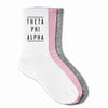 Theta Phi Alpha sorority crew socks with sorority name printed on the socks