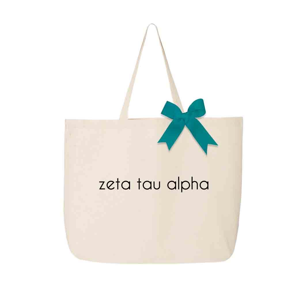 Zeta Tau Alpha sorority name custom printed on canvas tote bag with bow in sorority color