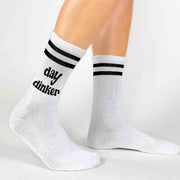 Day dinker digitally printed on the side of white cotton crew socks with black stripes are perfect for the pickleballer.