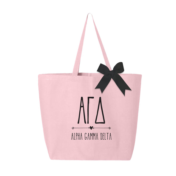 Alpha Gamma Delta sorority name custom printed in black ink on pink canvas tote bag with a black bow