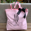 Alpha Phi sorority name and letters custom printed on pink tote bag with black bow