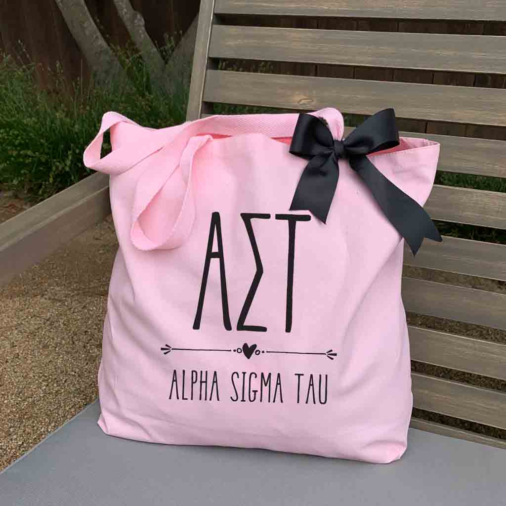 Alpha Sigma Tau sorority name and letters custom printed on pink canvas tote bag with black bow