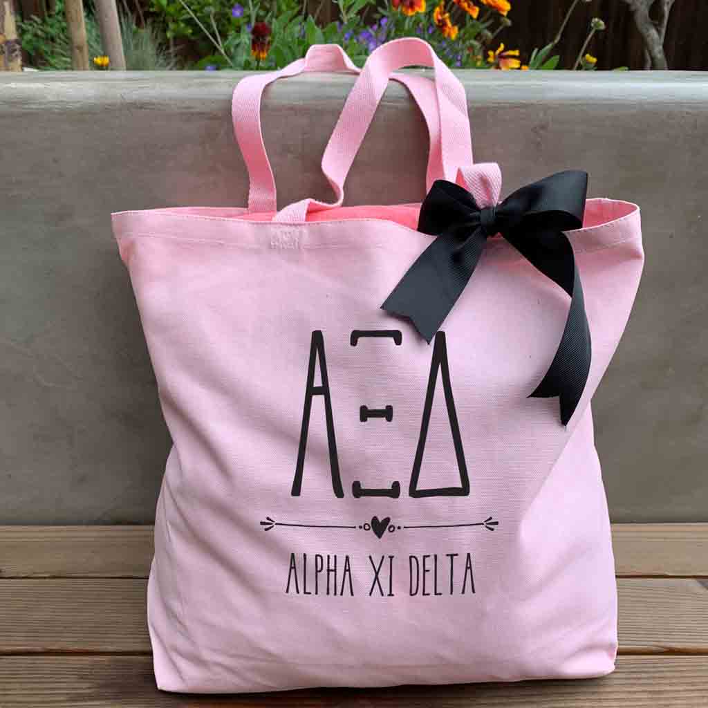 Alpha Xi Delta sorority name and letters custom printed on pink canvas tote bag with black bow 