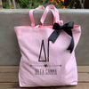 Delta Gamma sorority name and letters custom printed on pink canvas tote bag with black bow