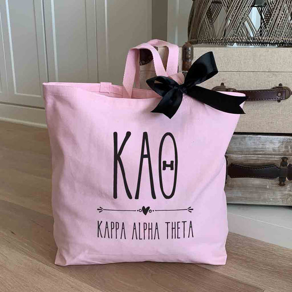 Kappa Alpha Theta sorority letters and name custom printed on pink canvas tote bag with black bow