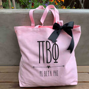 Pi Beta Phi sorority letters and name custom printed on pink canvas tote bag with black bow