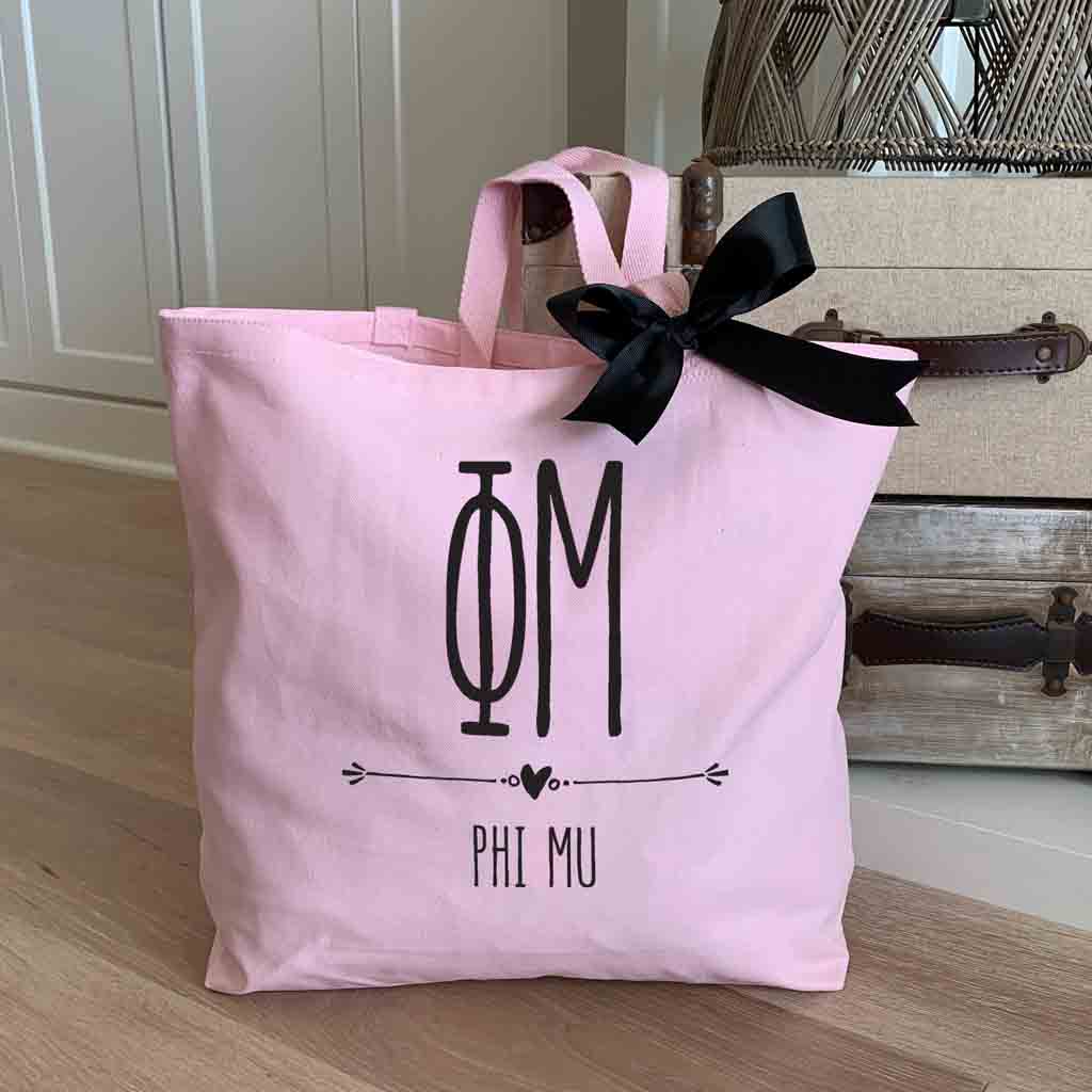 Phi Mu sorority letters and name custom printed on pink canvas tote bag with black bow