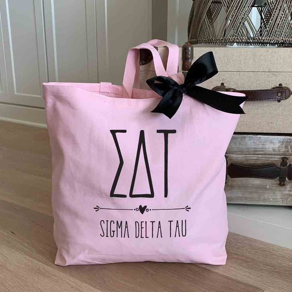 Sigma Delta Tau sorority name and letters custom printed on pink canvas tote bag with black bow