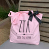 Zeta Tau Alpha sorority name and letters custom printed on pink canvas tote bag with black bow