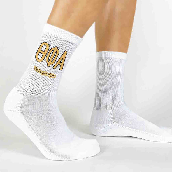 Theta Phi Alpha sorority letters and name digitally printed in sorority colors on white crew socks.