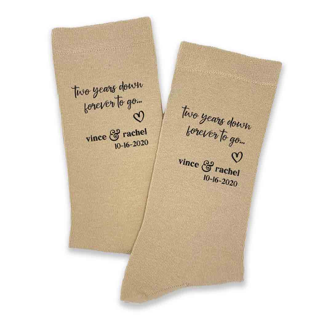 Two year anniversary gift of cotton custom printed socks personalized with names and wedding date in black ink on tan cotton dress socks