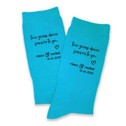 Two year anniversary gift of cotton custom printed socks personalized with names and wedding date in black ink on turquoise cotton dress socks