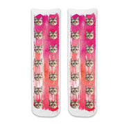 Custom cat photo socks personalized with your cats photos printed all over the cotton crew socks with pink paint brush background.
