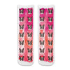 Cute custom dog photo socks personalized using your dogs photos printed all over the cotton crew socks with pink paint brush background.