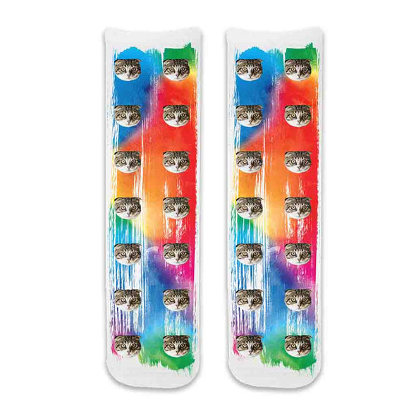 Custom cat photo socks personalized with your cats photos printed all over the cotton crew socks with rainbow paint brush background.