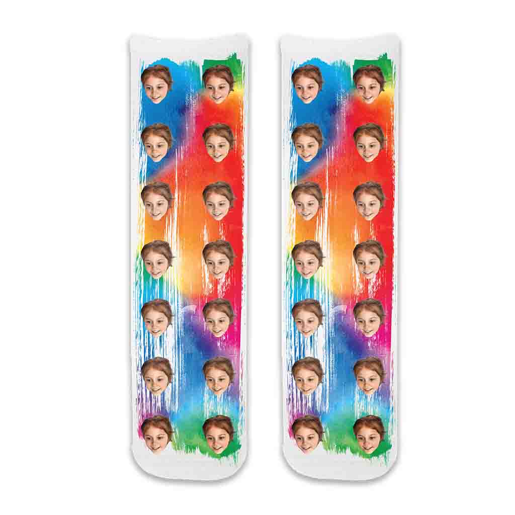 Custom printed photo face socks personalized with your picture on cotton crew socks and beautiful rainbow paint brush background are super soft and comfy.