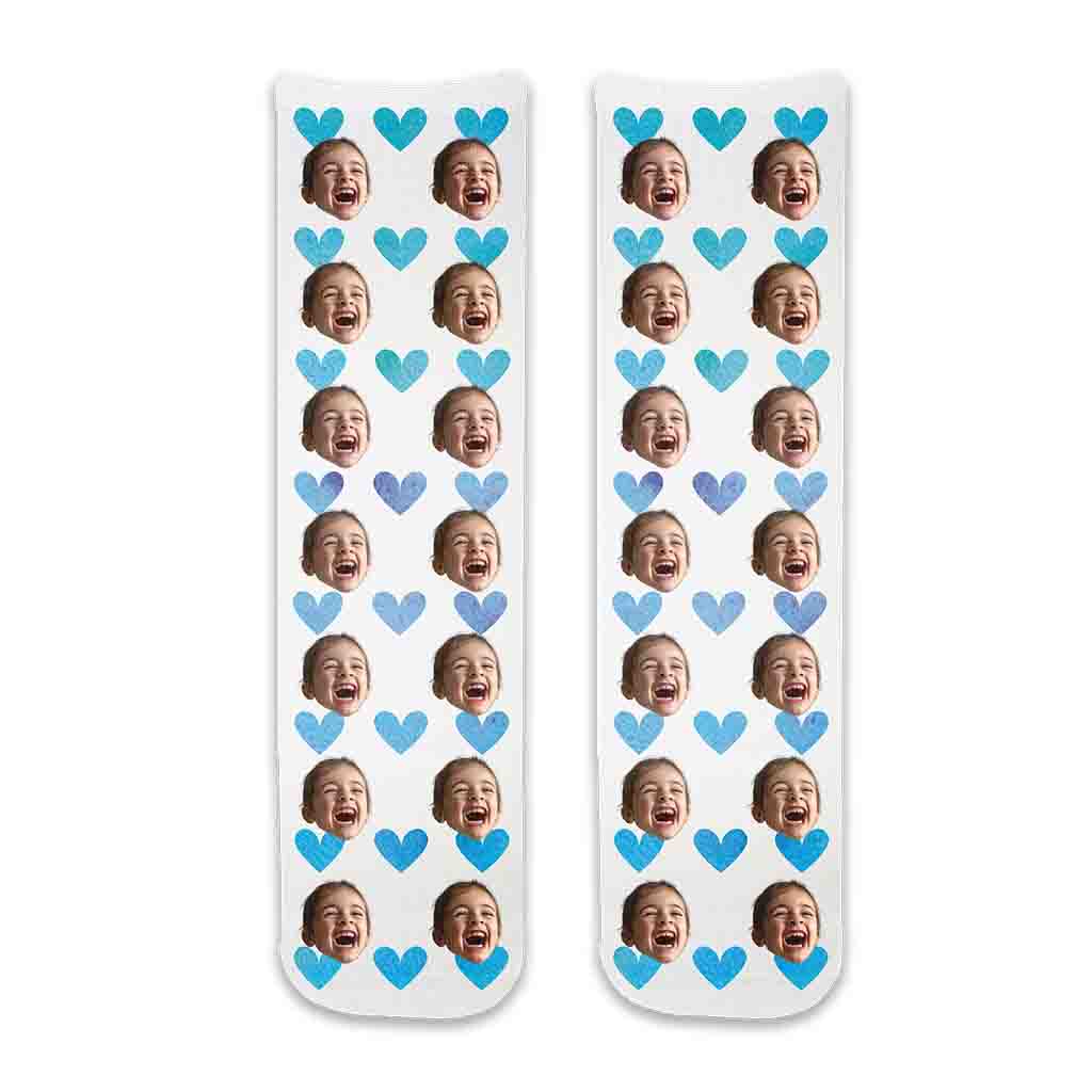 Photo face socks personalized using your photos custom printed on cotton crew socks with blue hearts background is a fun idea for a baby shower favor or new parents!