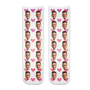 Custom printed face socks personalized using your photos we crop the face and full print design printed on cotton crew socks with the pink hearts background makes a great gift for your special someone.