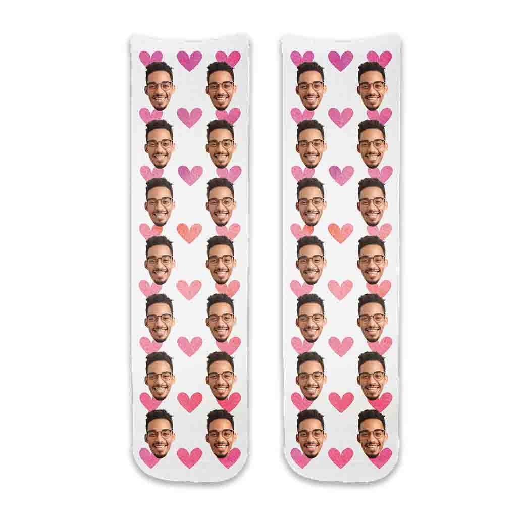 Custom printed face socks personalized using your photos we crop the face and full print design printed on cotton crew socks with the pink hearts background makes a great gift for your special someone.