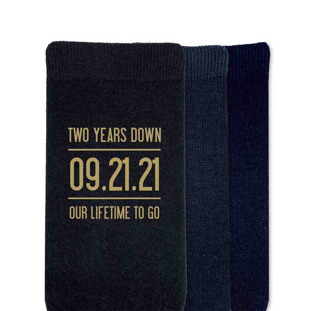 Two years down our lifetime to go digitally printed in gold ink personalized with your wedding date on cotton socks.