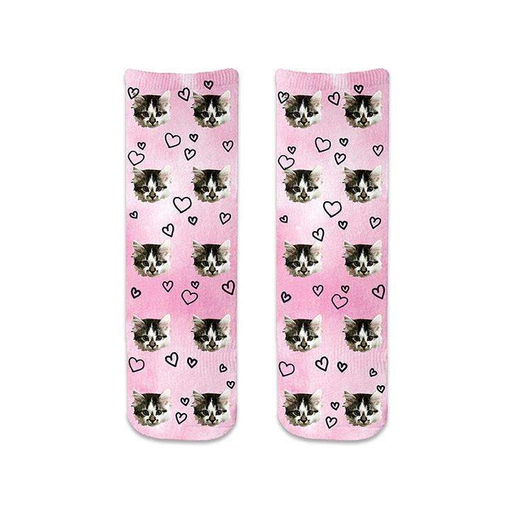 Custom photo face socks with hearts printed all over with a back ground design full printed on the socks.