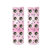 Custom photo face socks with hearts printed all over with a back ground design full printed on the socks.