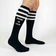 Comfortable black knee high socks with white stripes custom printed in white ink for your bachelorette party!