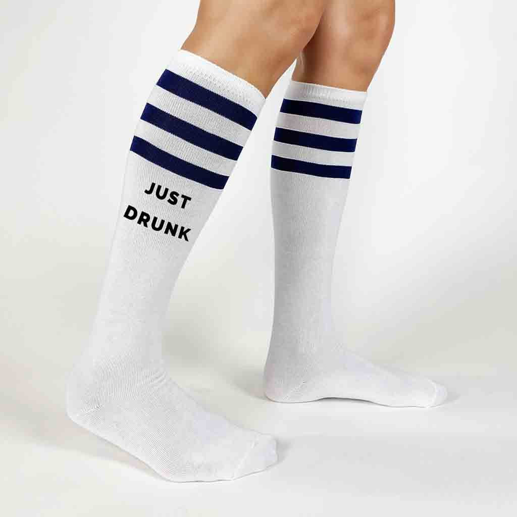 Custom bachelorette party white knee high socks with navy blue stripes digitally printed with drunk in love and just drunk
