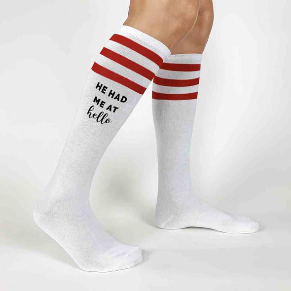 Custom knee high socks with red stripes digitally printed with he had me at hello and you had me at merlot for your bachelorette party