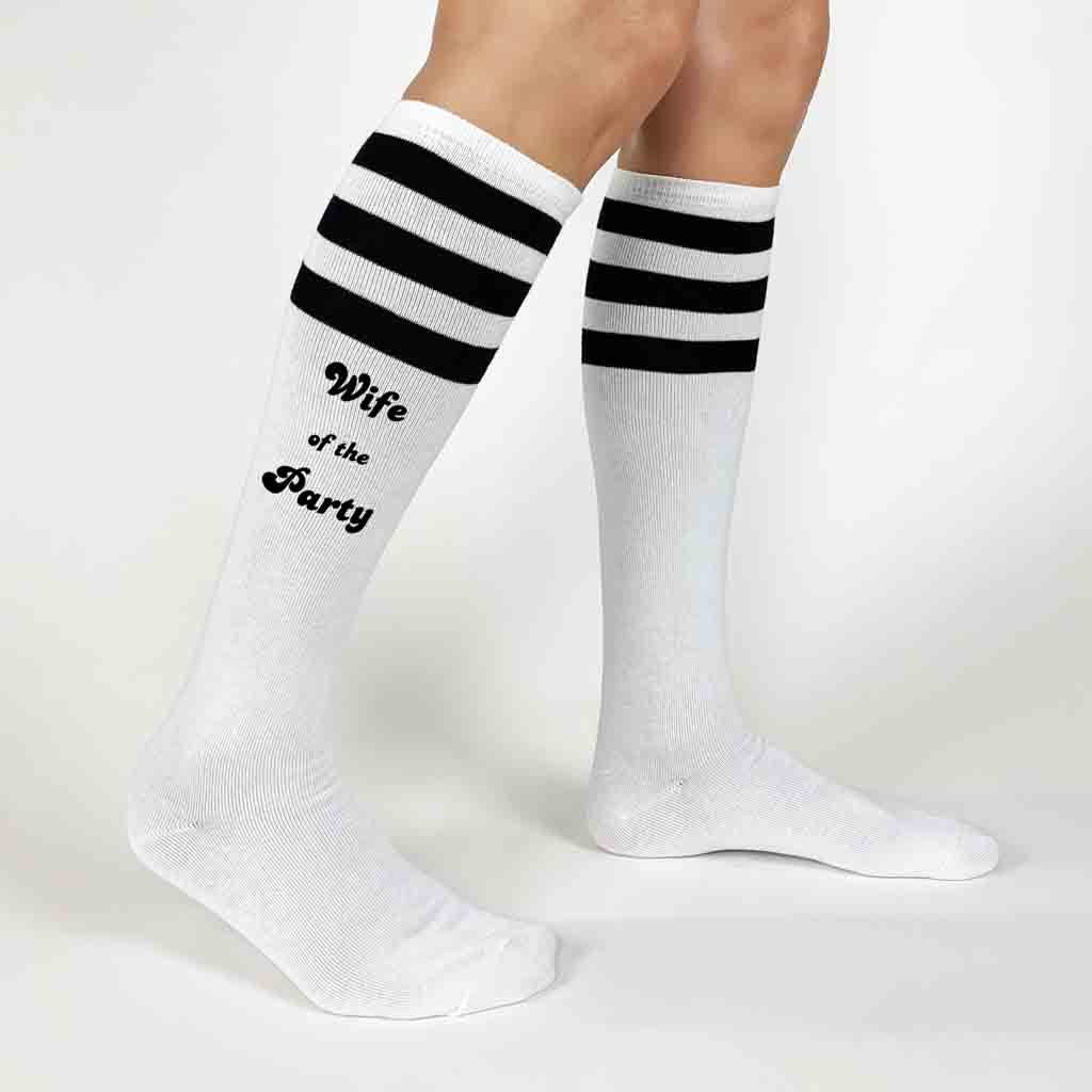 Custom white knee high socks with black stripes digitally printed with wife of the party and the party for your bachelorette party 