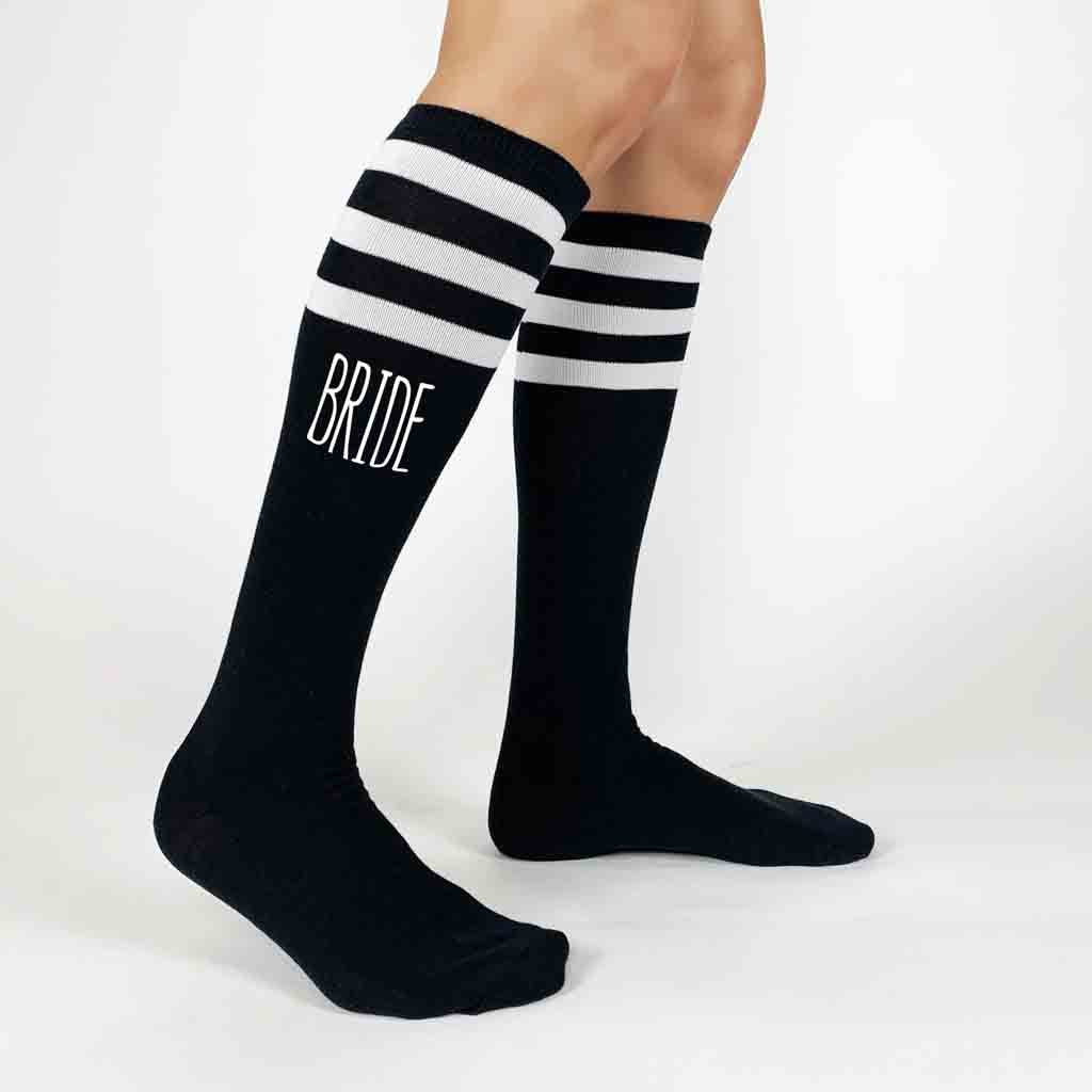 Custom printed bachelorette party knee high socks in black with white ink and stripes