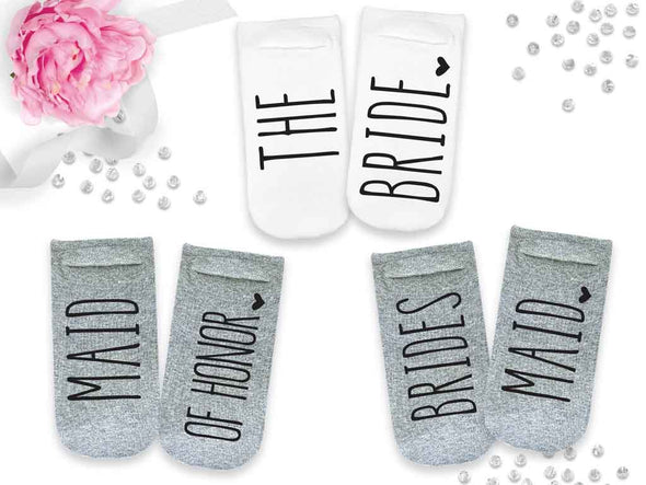 Super cute bridesmaid gifts with the wedding role printed on the bottom of the foot.