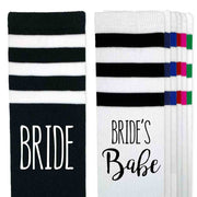 Bachelorette party knee high socks custom printed with bride and bride's babe on the side of the striped knee high socks.