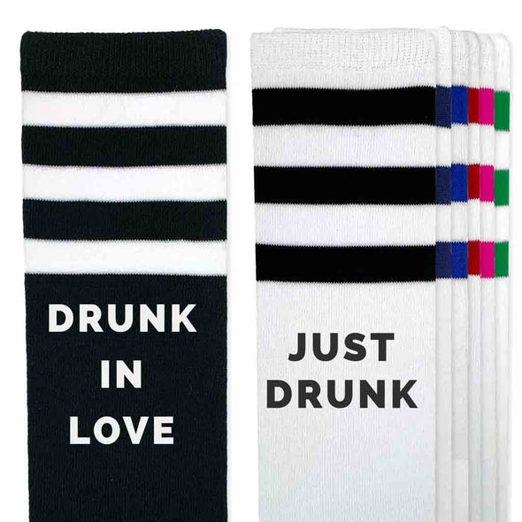 Bachelorette party socks custom printed with drunk in love and just drunk on the side of the striped knee high socks.