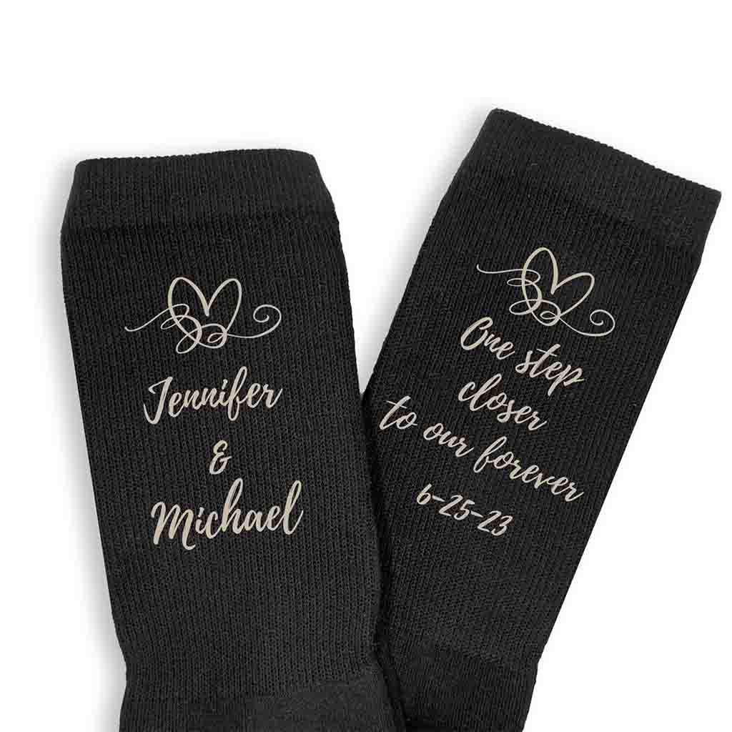 One step closer to our forever with heart design and personalized with your names and wedding date digitally printed on flat knit dress socks.