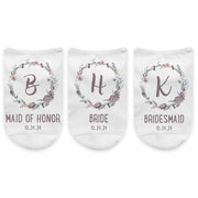 Monogram initial digitally printed inside a floral design and personalized with wedding role and your wedding date on no show socks.