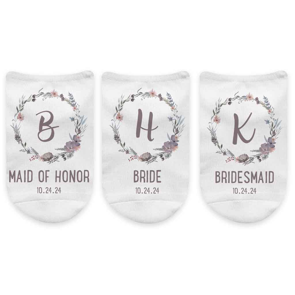 Monogram initial digitally printed inside a floral design and personalized with wedding role and your wedding date on no show socks.