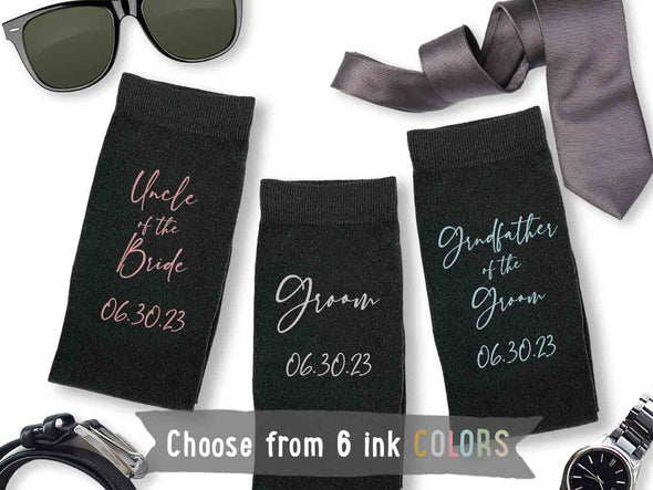 Custom printed socks for the wedding party with script writing with colored ink and wedding date.