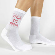 Alpha Chi Omega name in sorority color design by sockprints custom printed on white cotton crew socks.