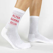 Highlight your Alpha Gamma Delta pride with a pair of these Alpha Gamma Delta crew socks printed in sorority colors. 